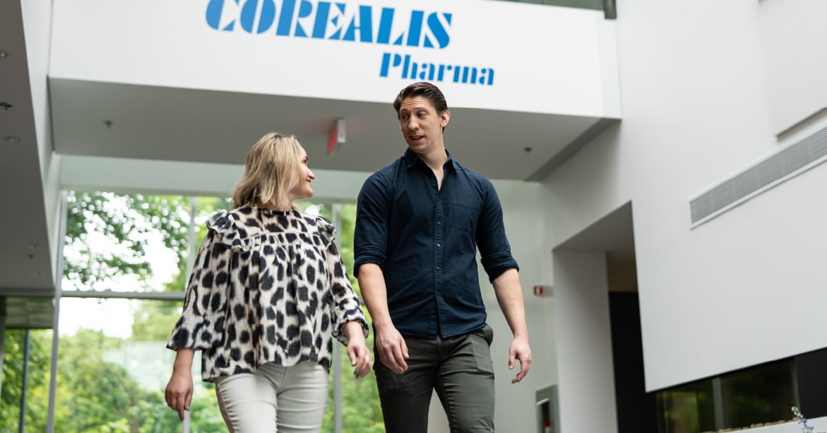 Two Corealis team members walking through their newly expanded facility in Laval, Quebec.
